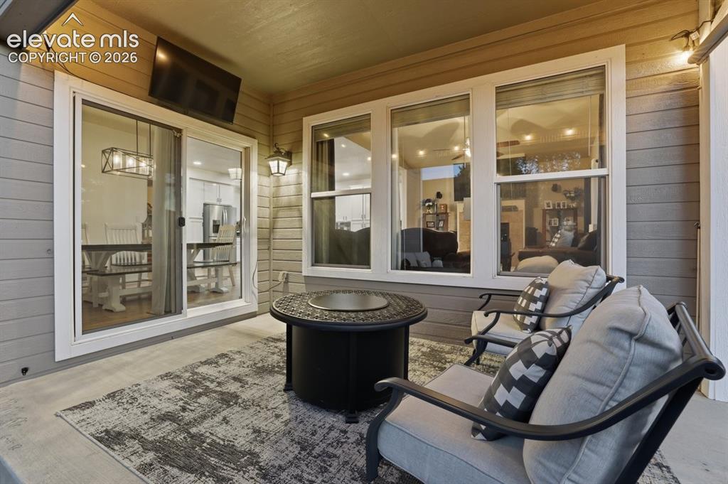 Image 41 of 50: cozy patio space with the option to watch TV
