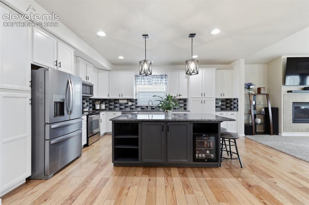 Image 9 of 50: designer kitchen with accent island