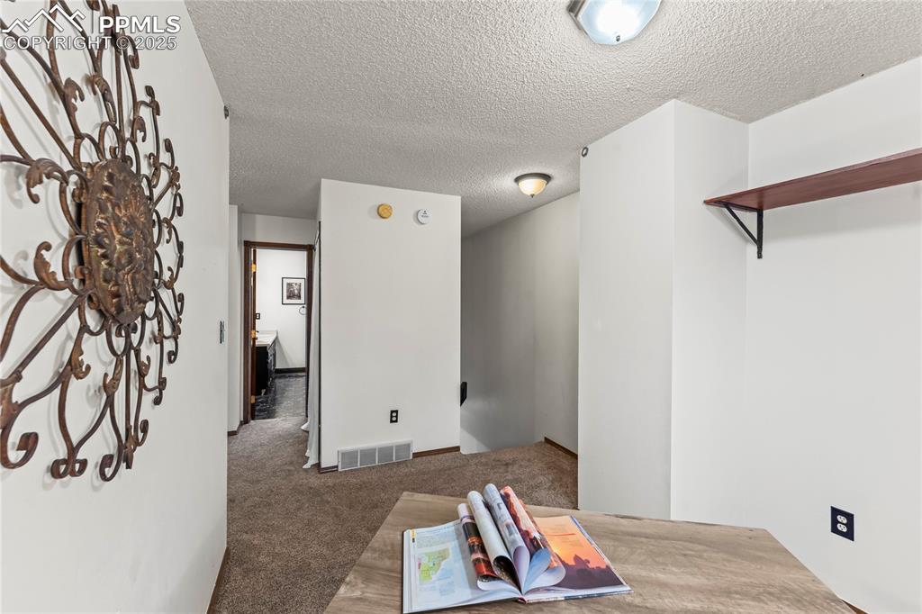 Image 12 of 21: Open loft area perfect for sitting room or office