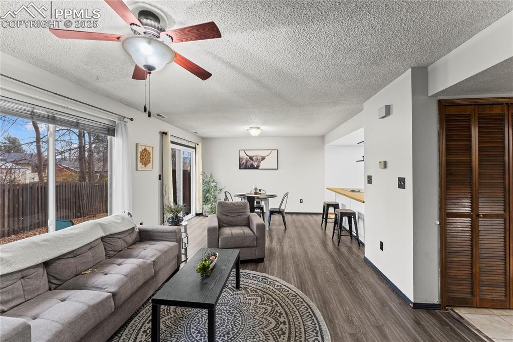 Image 2 of 21: Enter into family room, open floor plan with natural light.