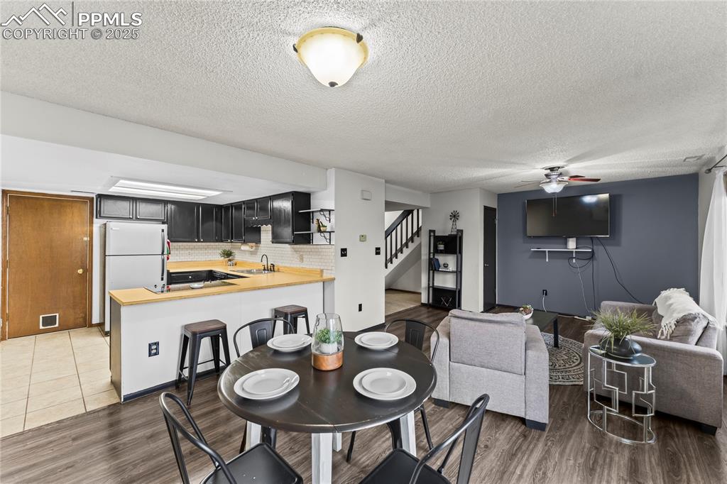 Image 5 of 21: Kitchen with breakfast bar, open floor plan