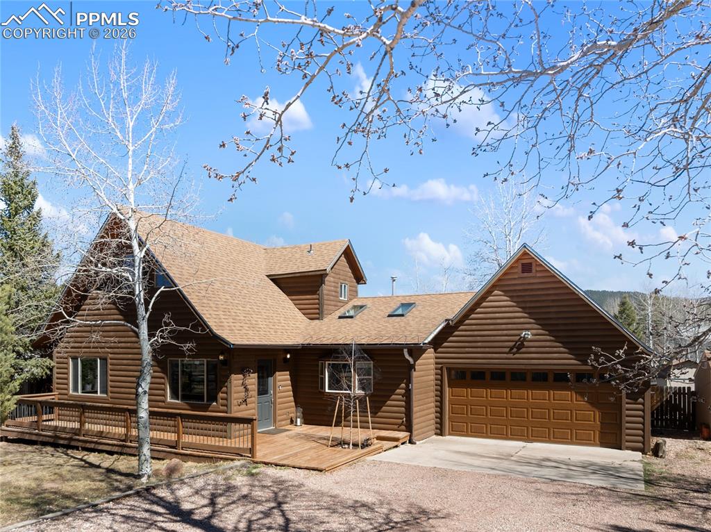 Image 1 of 50: Classic Woodland Park, Beautiful log siding, 2 car garage, large porch, no