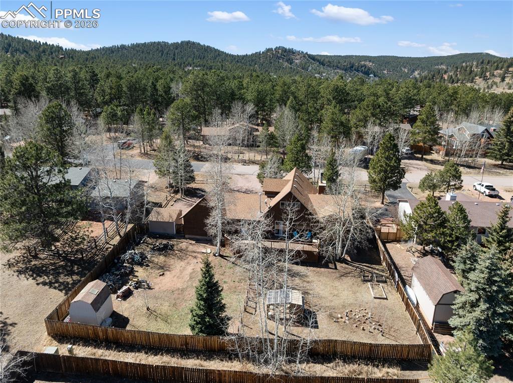 Image 21 of 50: Backyard is fully fenced and sectioned off already between dog area and chi