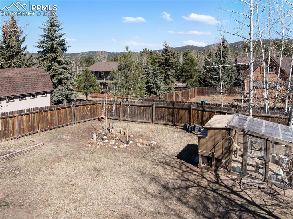 Image 24 of 50: Chicken coop stays, great flat yard