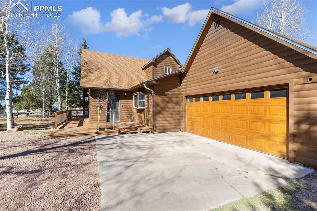 Image 25 of 50: Perfectly maintained exterior, 2 car attached garage with newer garage door