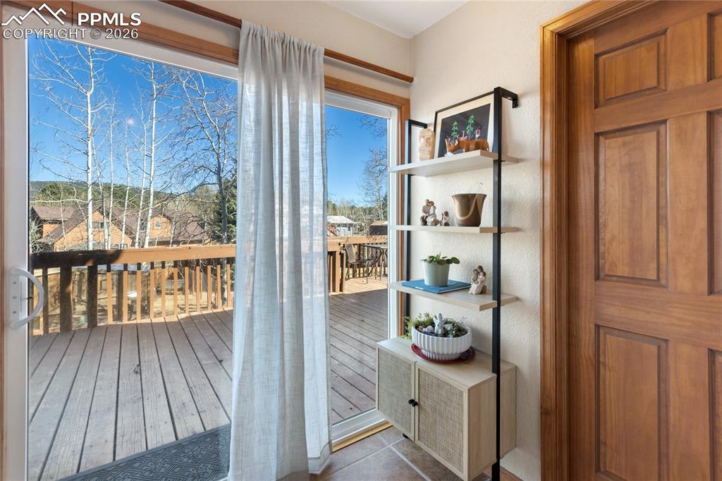 Image 27 of 50: Access to the huge back deck and yard