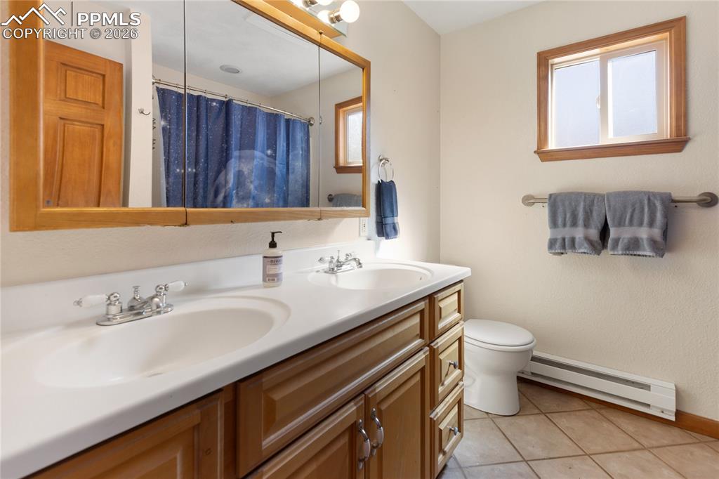 Image 36 of 50: Second level full bath, double vanity