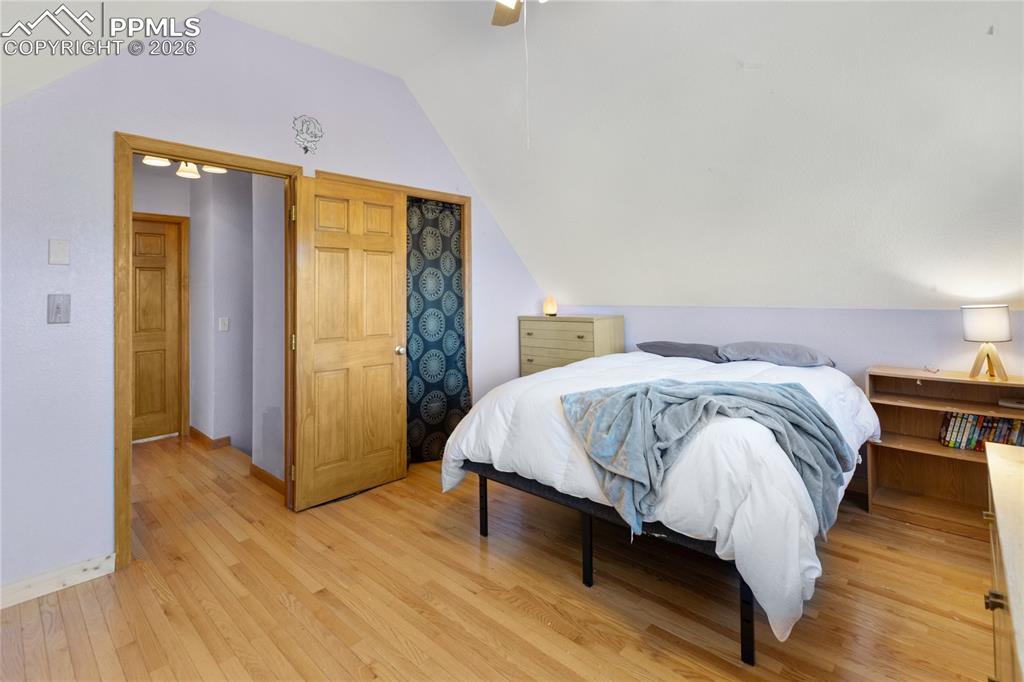 Image 38 of 50: Second level bedroom, hard wood floors, vaulted ceilings, large windows, le