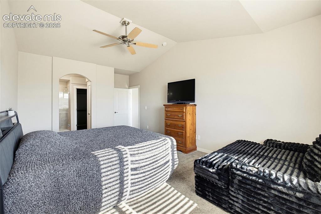 Image 35 of 50: Vaulted ceiling with an integrated multi-blade ceiling fan and a distinctiv