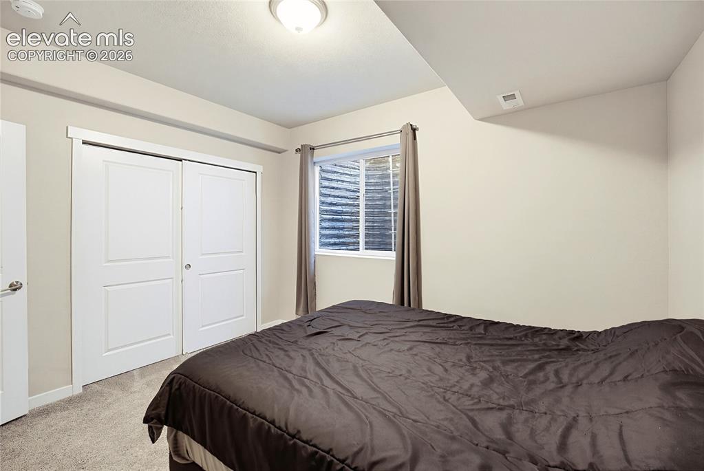 Image 45 of 50: Room featuring neutral wall paint, carpeted flooring, a recessed window wit