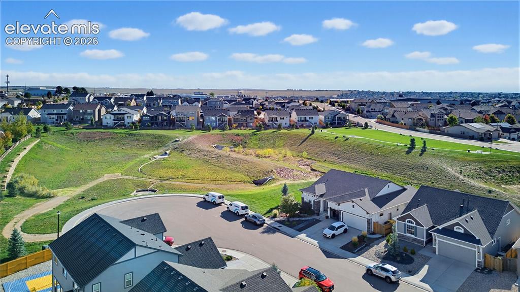 Image 9 of 50: Aerial perspective showcasing a suburban residential layout featuring cul-d
