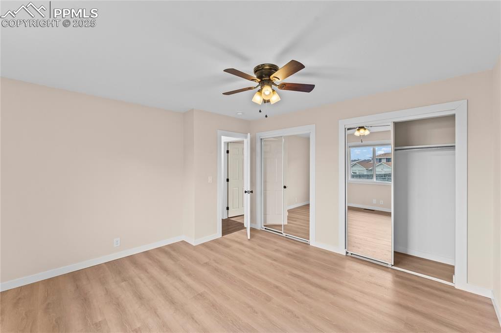 Image 10 of 34: First Floor Primary - Unfurnished bedroom with light wood finished floors, 