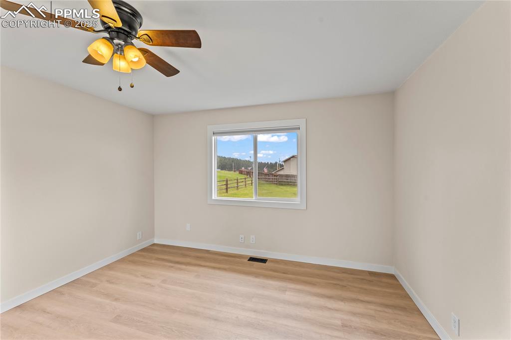 Image 11 of 34: First Floor Primary - Unfurnished bedroom with light wood-type flooring and