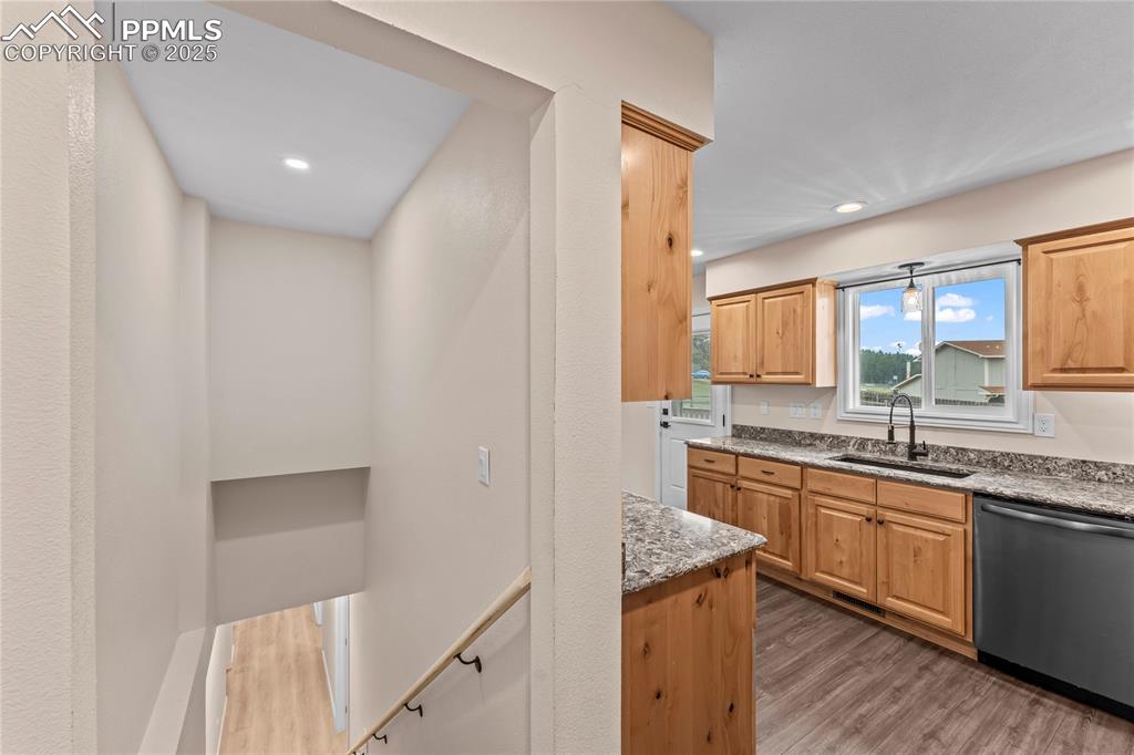 Image 15 of 34: Kitchen featuring dishwasher, wood finished floors, recessed lighting, and 