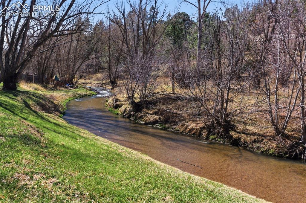 Image 2 of 50: Peaceful Monument Creek Runs Behind The Home