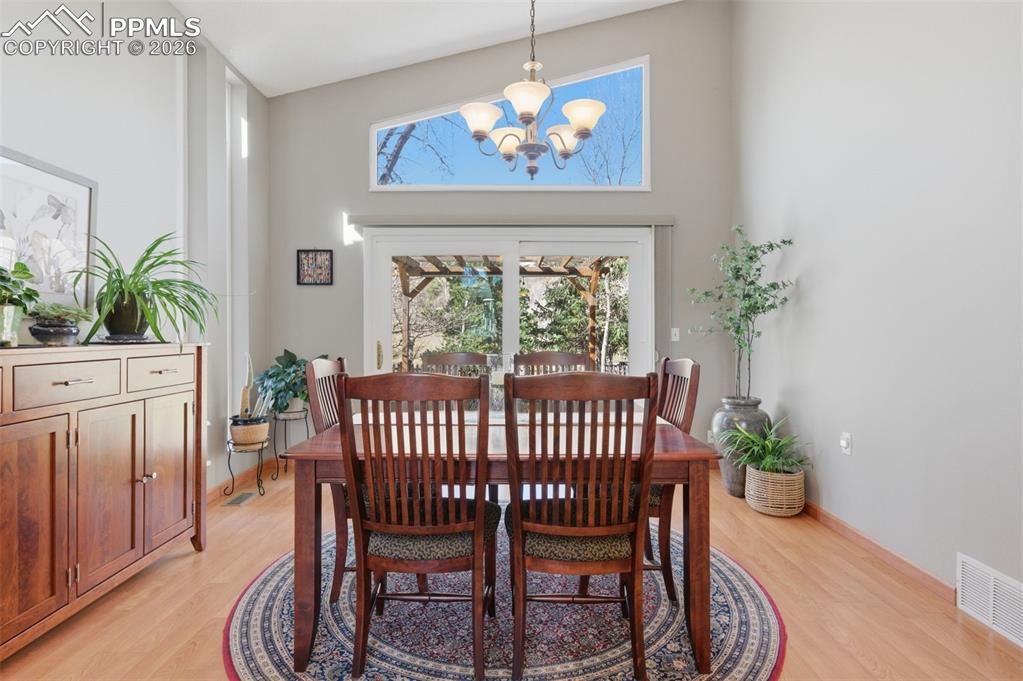 Image 9 of 50: Dining Room Opens To Rear Patio