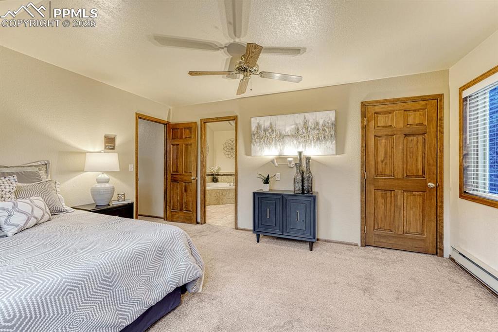 Image 13 of 40: Primary bedroom with ensuite