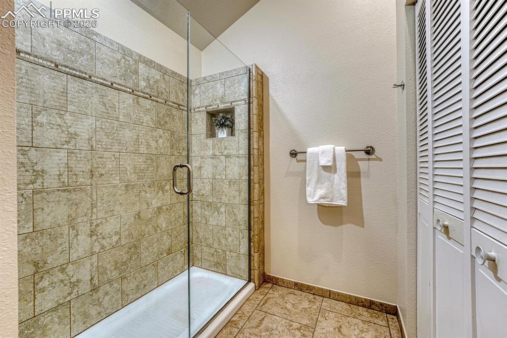 Image 16 of 40: primary shower and primary closet #2