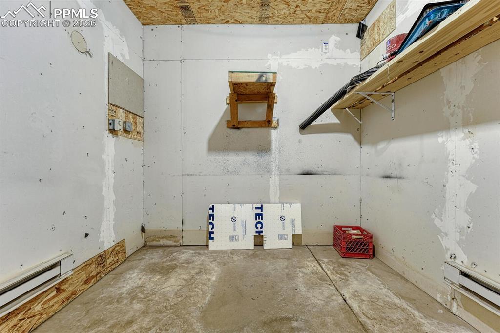 Image 33 of 40: heated hobby room in detached garage