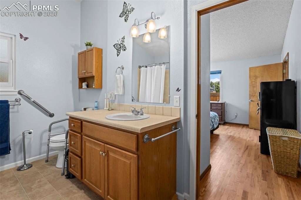 Image 21 of 26: Primary Bathroom -Handrails and wider spaces for wheelchair accessibility