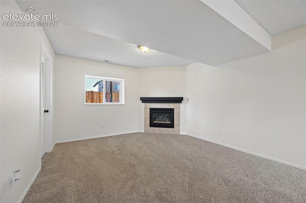 Image 20 of 34: Lower Level Living Room