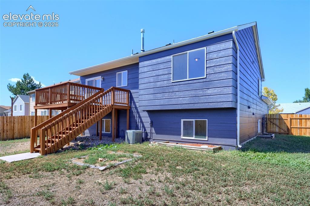 Image 31 of 35: Multi-level wood deck with staircase