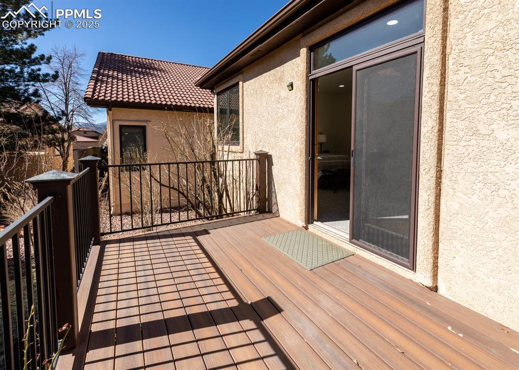 Image 47 of 50: Door from Primary Bedroom to deck with composite surface!