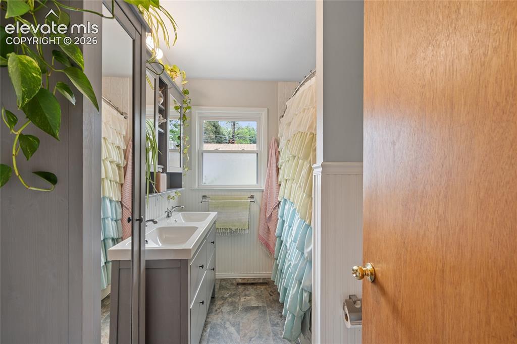 Image 11 of 27: Double Vanity in the updated full main bath