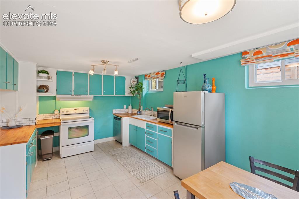 Image 15 of 27: Open and bright lower level kitchen