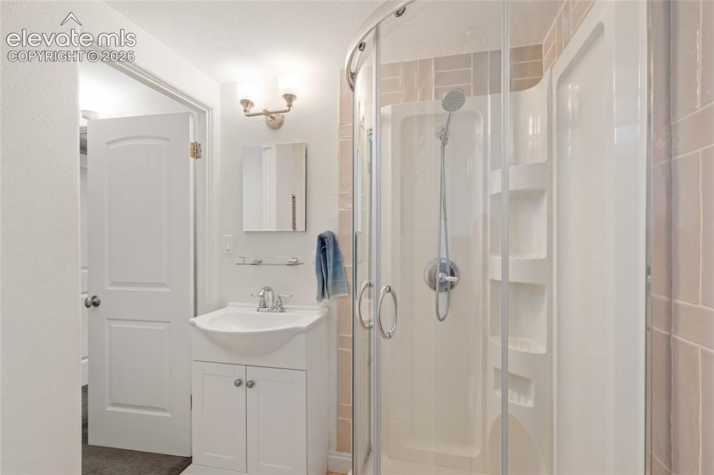 Image 19 of 27: Lower level 3/4 bath