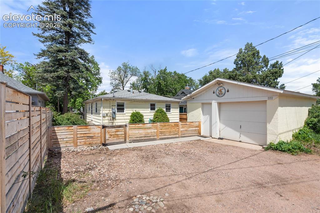 Image 22 of 27: Great detached one-car garage and off-street parking spaces