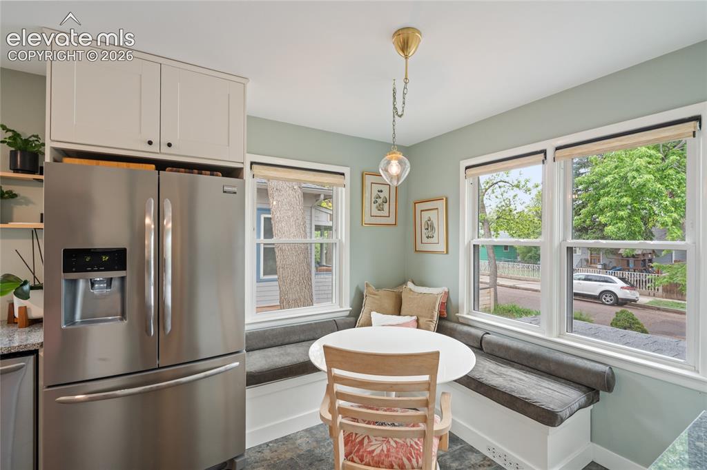 Image 8 of 27: Adorable built-in dining nook in the kitchen
