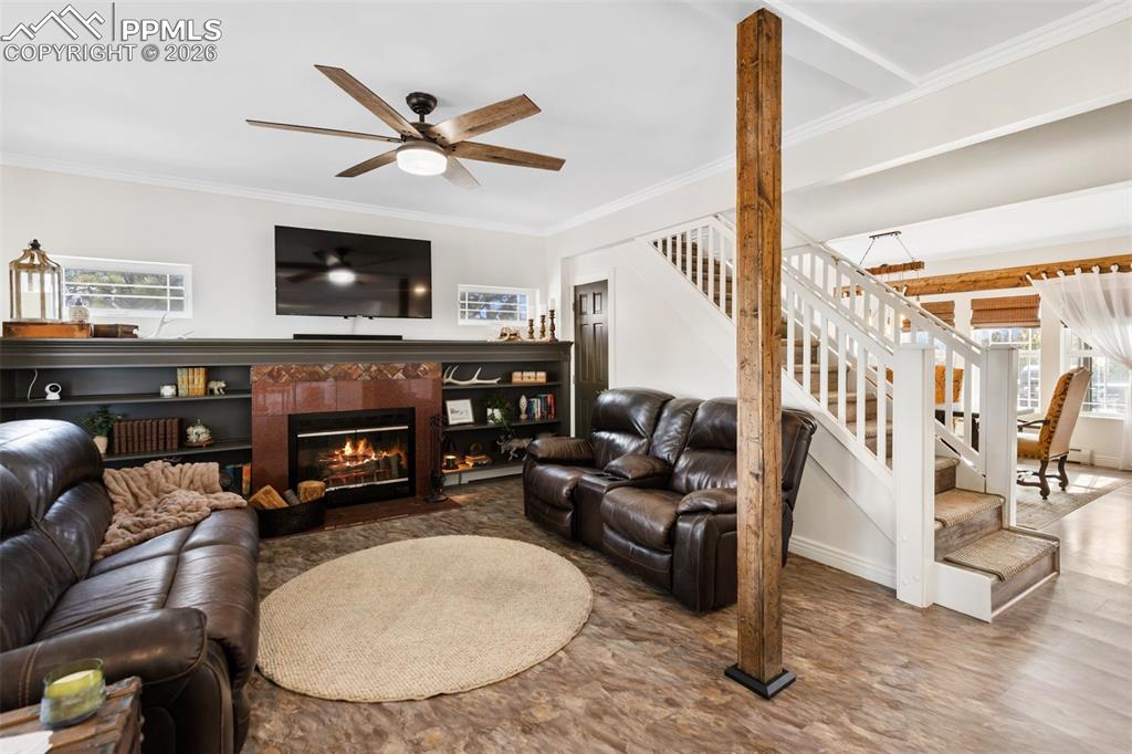 Image 11 of 50: Living room and wood burning fire place