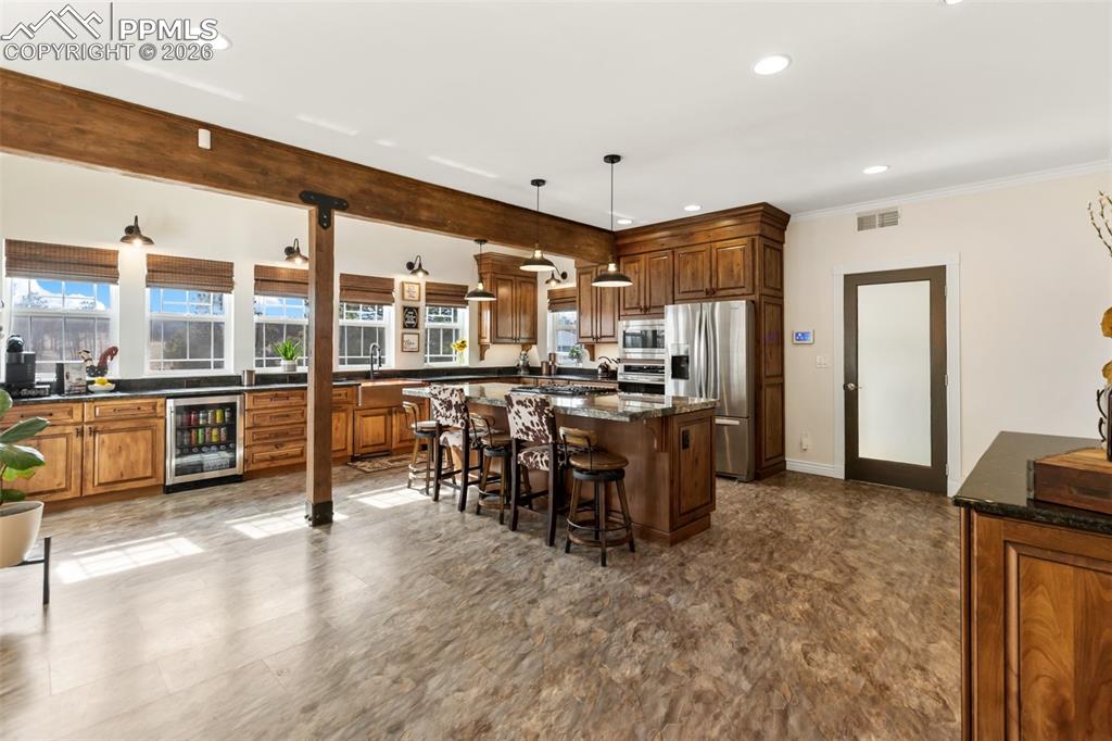 Image 13 of 50: Kitchen and breakfast bar