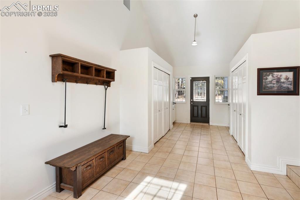 Image 18 of 50: Laundry and mud room, entry from outside. 
