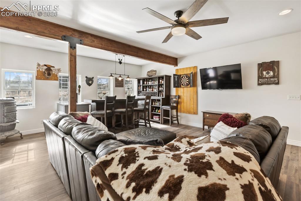 Image 25 of 50: Family room and dry bar