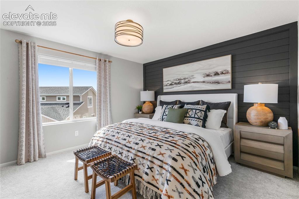 Image 24 of 31: Accent wall with horizontal paneling, wide window, flush mount ceiling ligh