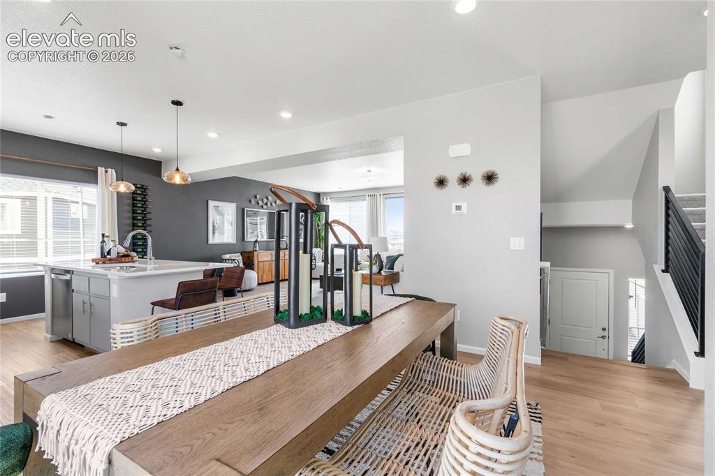 Image 4 of 31: Spacious dining area with wood-finish flooring
*photos of a model home*