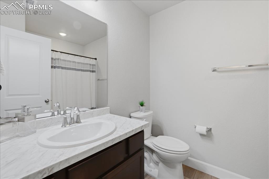 Image 35 of 47: Well-appointed bathroom featuring a vanity with a white countertop, an unde