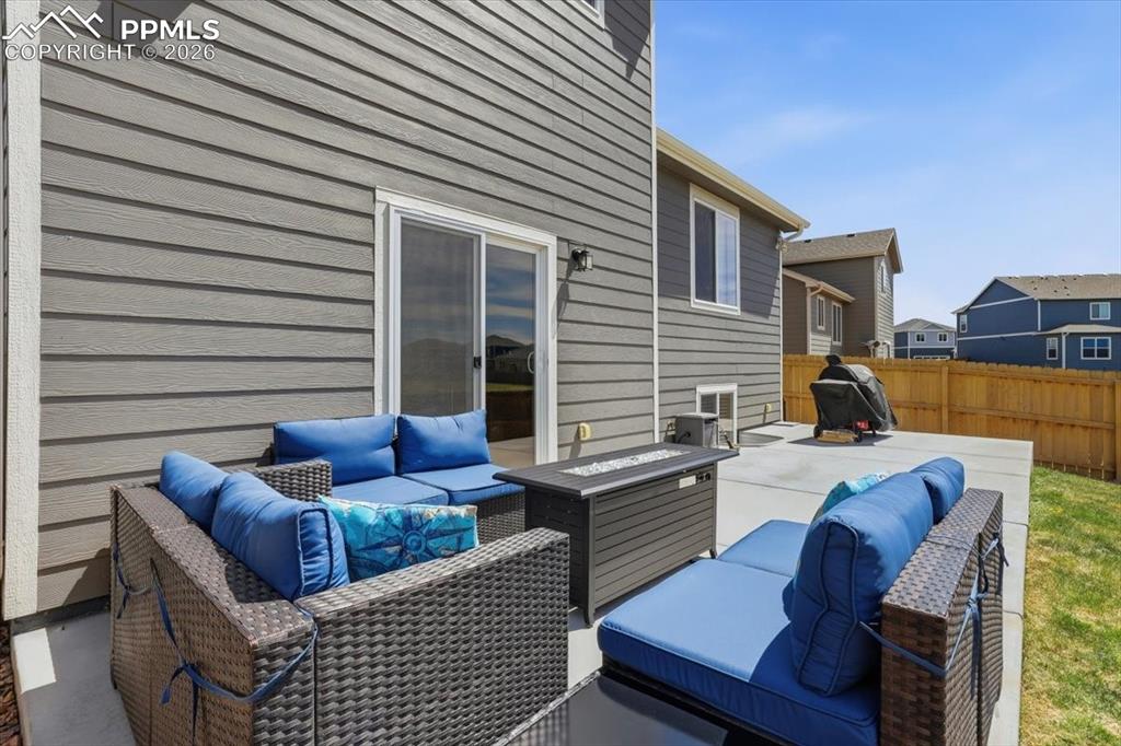 Image 41 of 47: The property features a concrete patio area with direct access to the inter