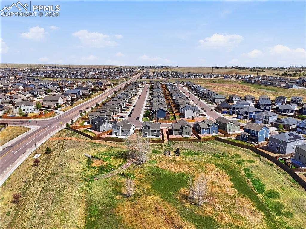 Image 45 of 47: Aerial view showcasing the surrounding neighborhood with residential proper