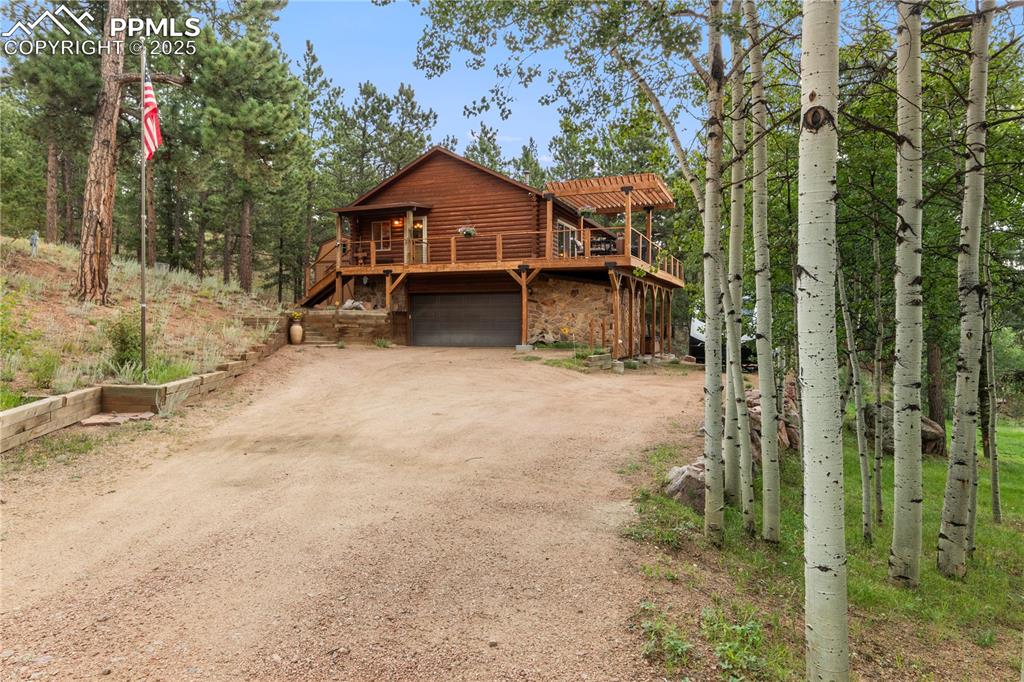 Caption: Luxury awaits in this custom log & stone chalet!  