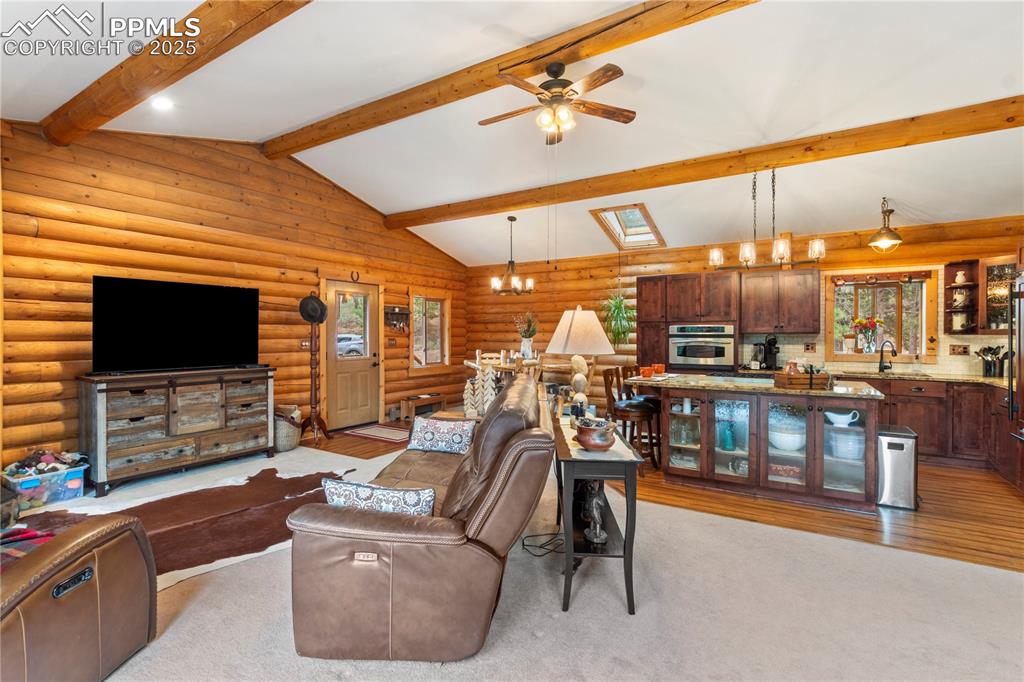 Image 11 of 46: Open concept living/dining/kitchen offer a great place to gather