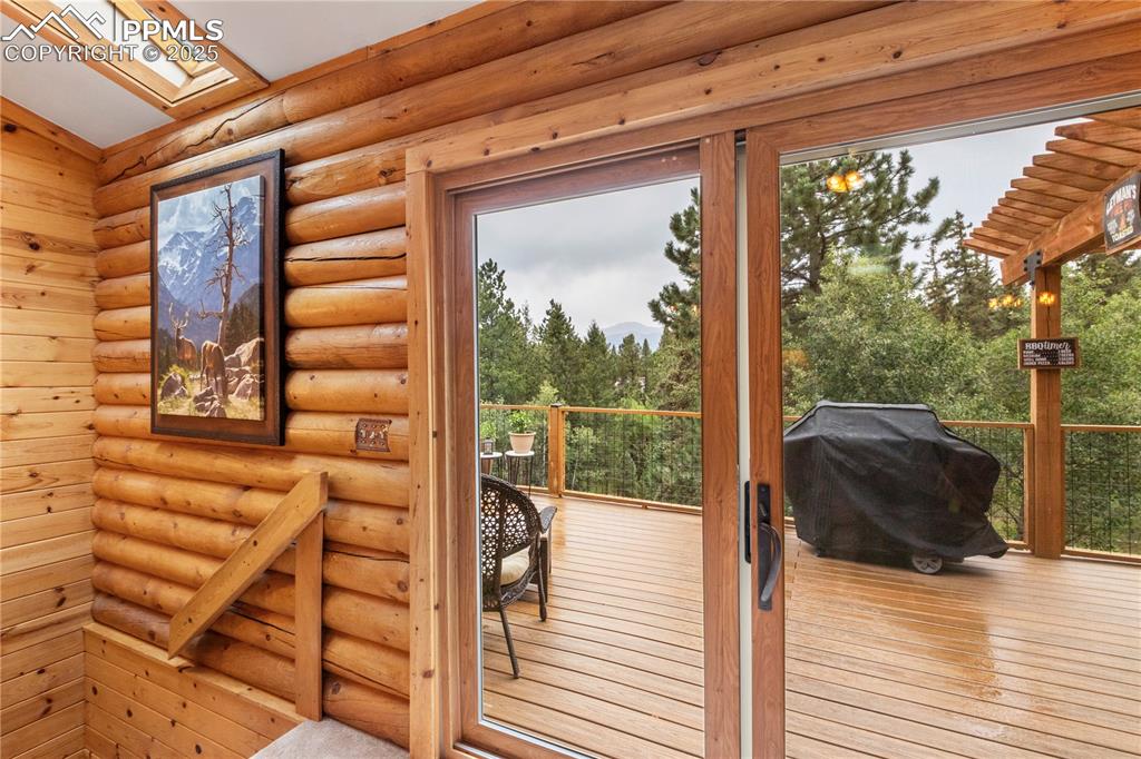 Image 15 of 46: Walk out to more entertainment space to the massive deck!