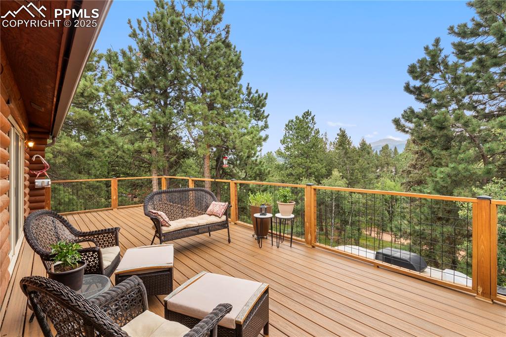 Image 16 of 46: Enjoy the mountain tops from this vantage point on the deck.