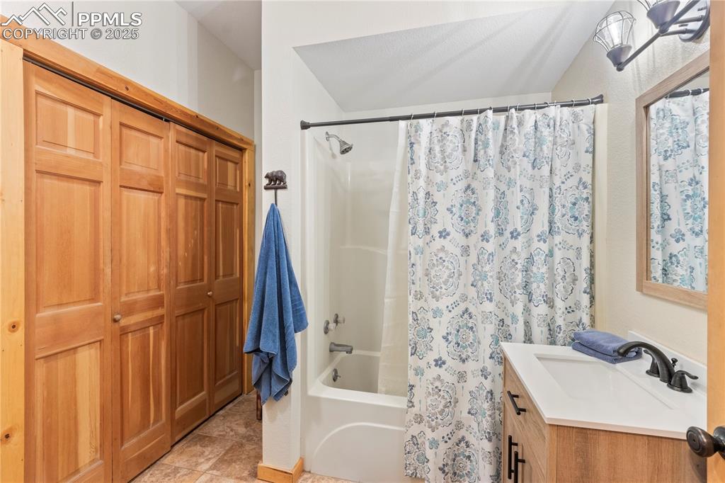Image 34 of 46: Full Bath on lower level has new vanity and toilet