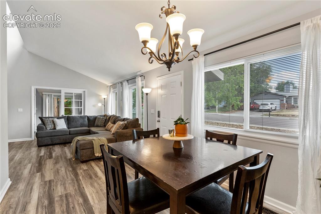 Image 11 of 20: Dining area opens to the living room