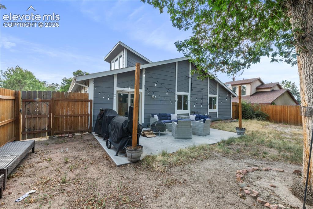 Image 19 of 20: Lots of seating area in backyard