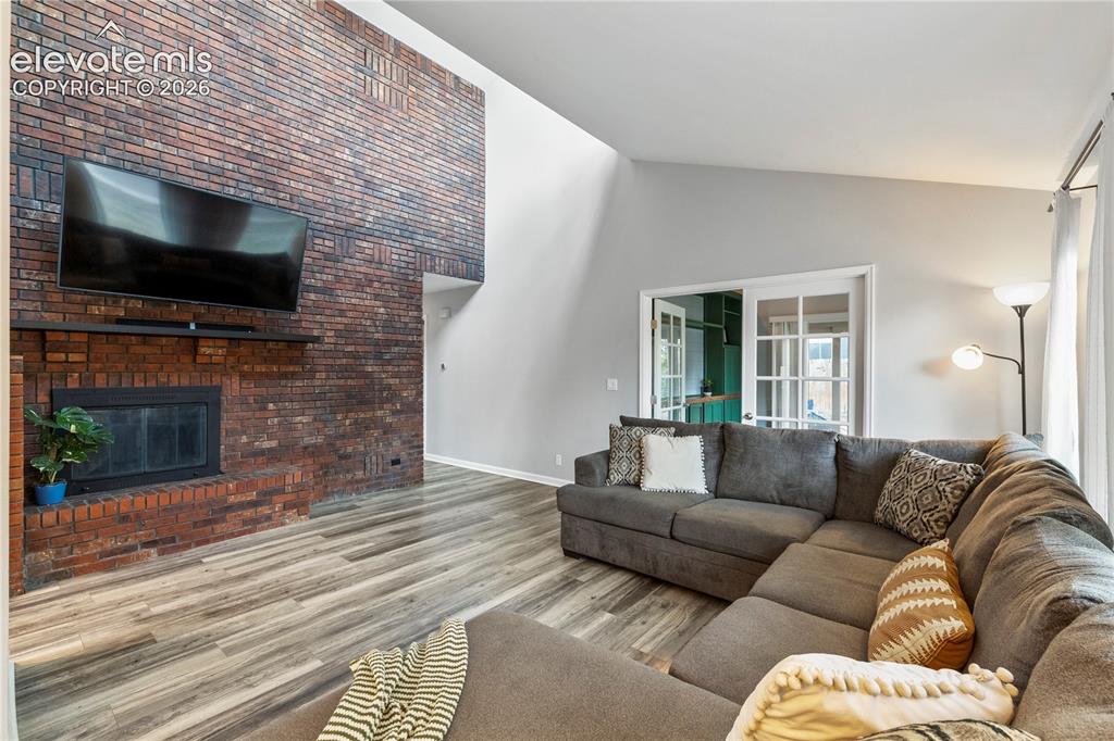 Image 5 of 20: Wood fireplace in living room