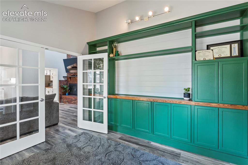 Image 7 of 20: Office has built ins and french doors